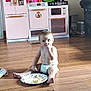 Isabella joined the competition — help win amazing prizes! baby, child, diaper, food, messy, floor, toy, doll, play_kitchen, pink, plate, wooden_floor, indoor, cute, child_eating, home, living_room, smudged_food, young_child, playtime