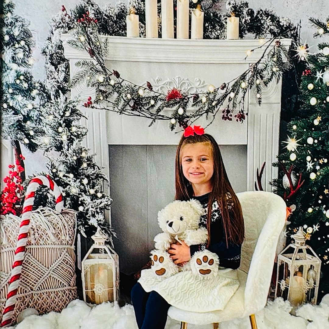 Myka is registered to the contest to win money with this photo: adult, animal, bride, candle, canine, child, christmas, christmasdecorations, christmastree, face, female, festival, girl, head, person, sitting, teddybear, toy, wedding, woman