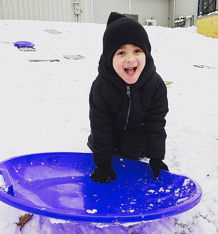 Jaelyn is registered to the contest to win money with this photo: child, freezing, fun, ice, joy, outerwear, person, play, playing_in_the_snow, purple, recreation, smile, snow, toddler, winter