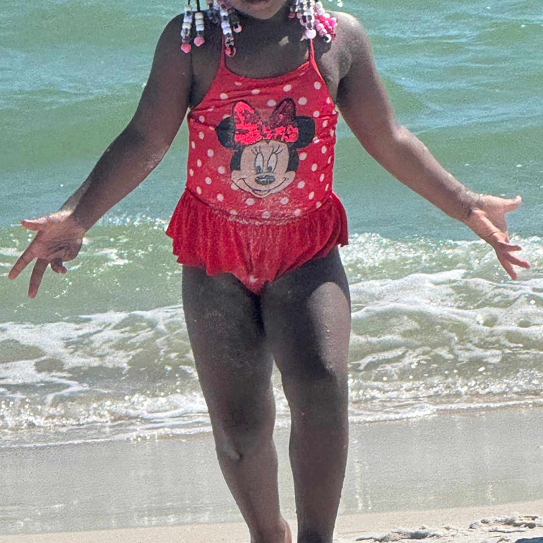 Tramira is registered to the contest to win money with this photo: beach, child, clothing, coast, face, female, girl, head, nature, outdoors, person, photography, portrait, sea, seawaves, shoreline, shorts, summer, swimwear, water