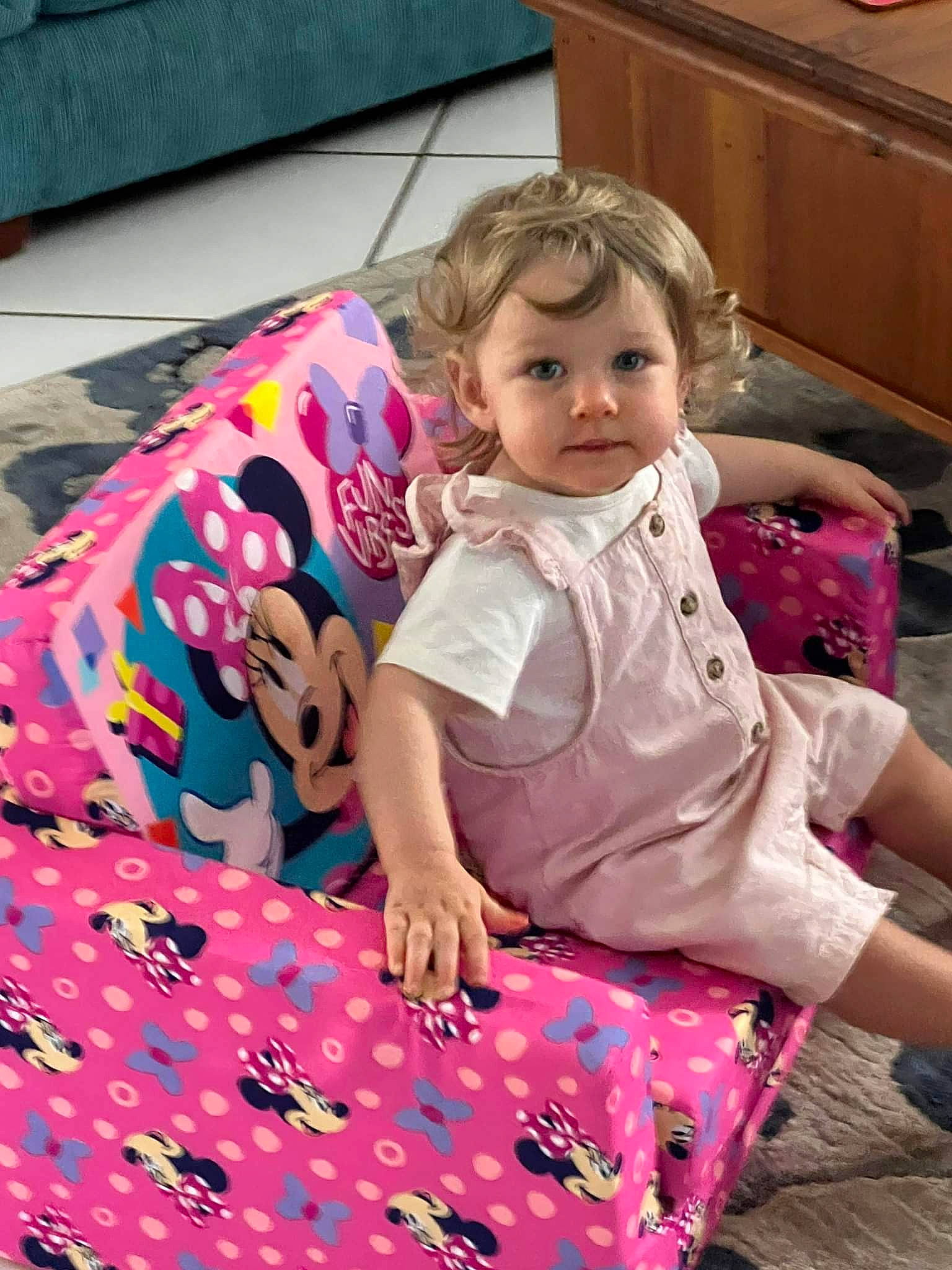 Leah is registered to the contest to win money with this photo: baby, baby_toddler_clothing, blond, cabinetry, child, drawer, dress, flooring, fun, happy, leisure, linens, magenta, pattern, person, pink, sitting, t_shirt, toddler, vacation