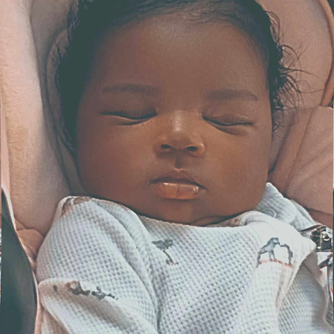 Yahxhari joined the competition — help win amazing prizes! baby, sleeping, infant, onesie, animal_print, cozy, cushion, seat, child, peaceful, cute, portrait, indoors, soft_lighting, closeup, resting, newborn, face, person, relaxation