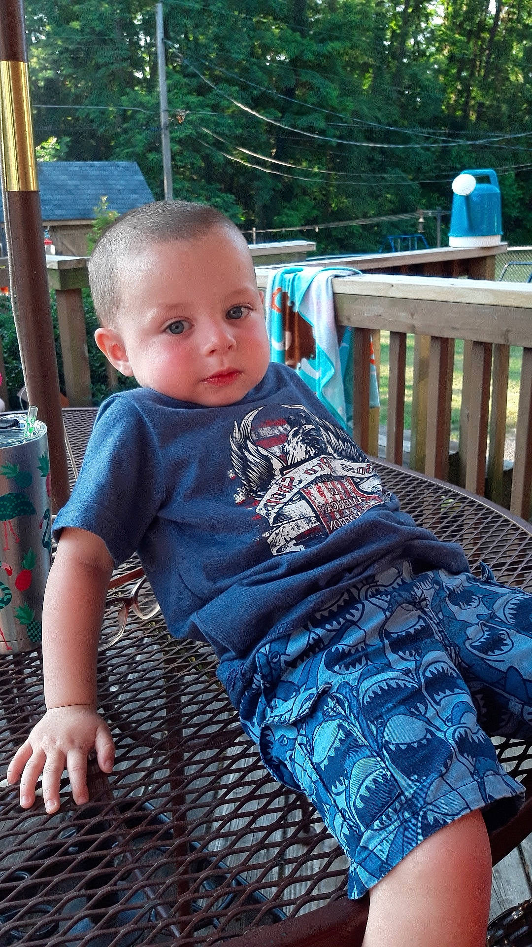 Izayic is registered to the contest to win money with this photo: baby, baby_toddler_clothing, backyard, child, deck, dress, pattern, person, sitting, summer, toddler, tree, vacation