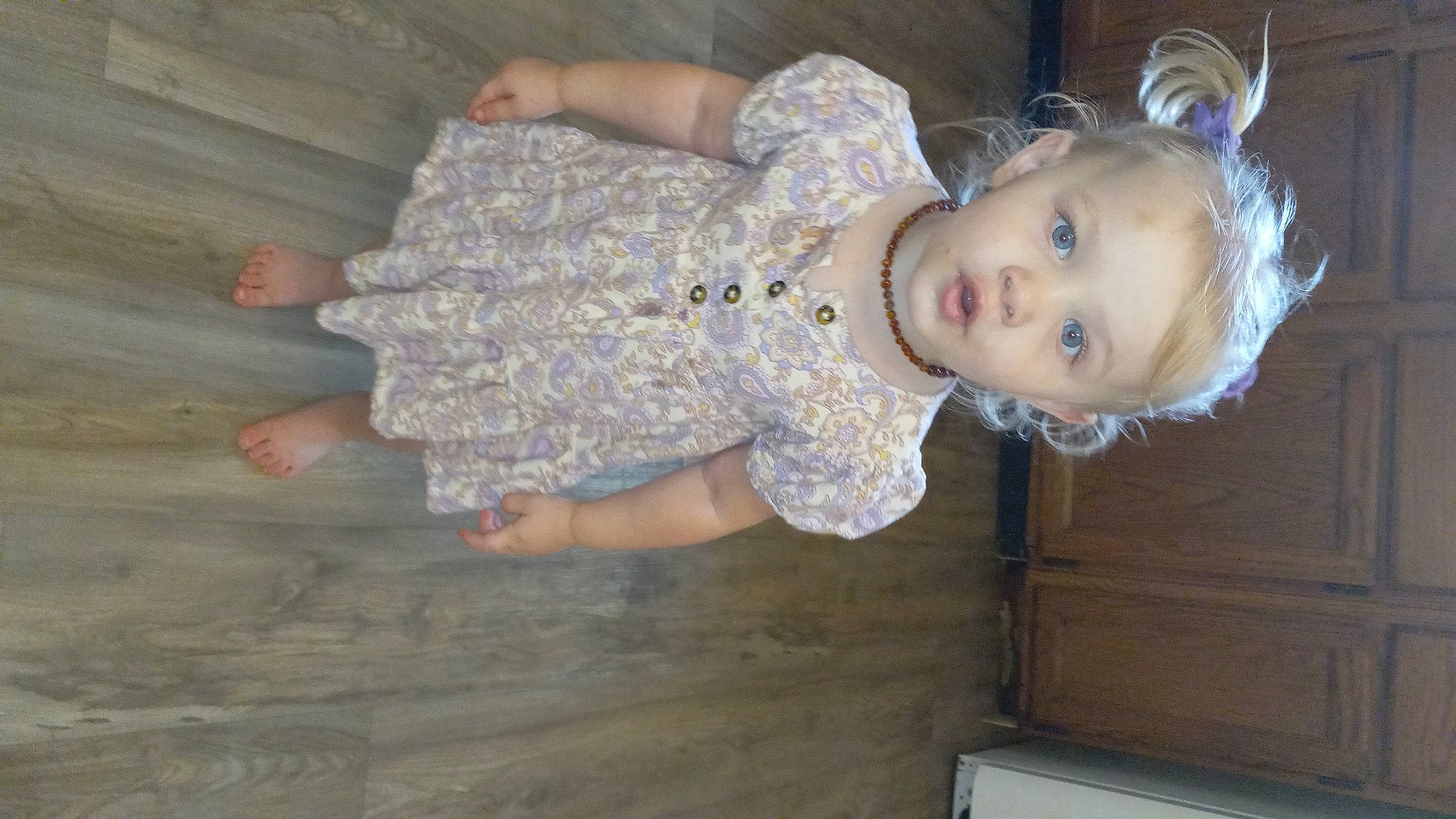 Kassie joined the competition — help win amazing prizes! baby, baby_toddler_clothing, cheek, child, embellishment, fun, gesture, iris, pattern, person, sitting, sleeve, smile, thumb, toddler, wood