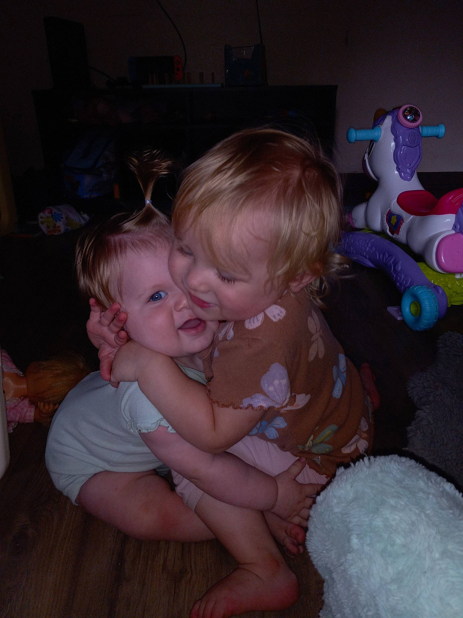 Kassie is registered to the contest to win money with this photo: baby, baby_toddler_clothing, chair, cheek, child, comfort, flooring, fun, happy, iris, lap, organ, person, pink, room, sitting, skin, smile, toddler, toy