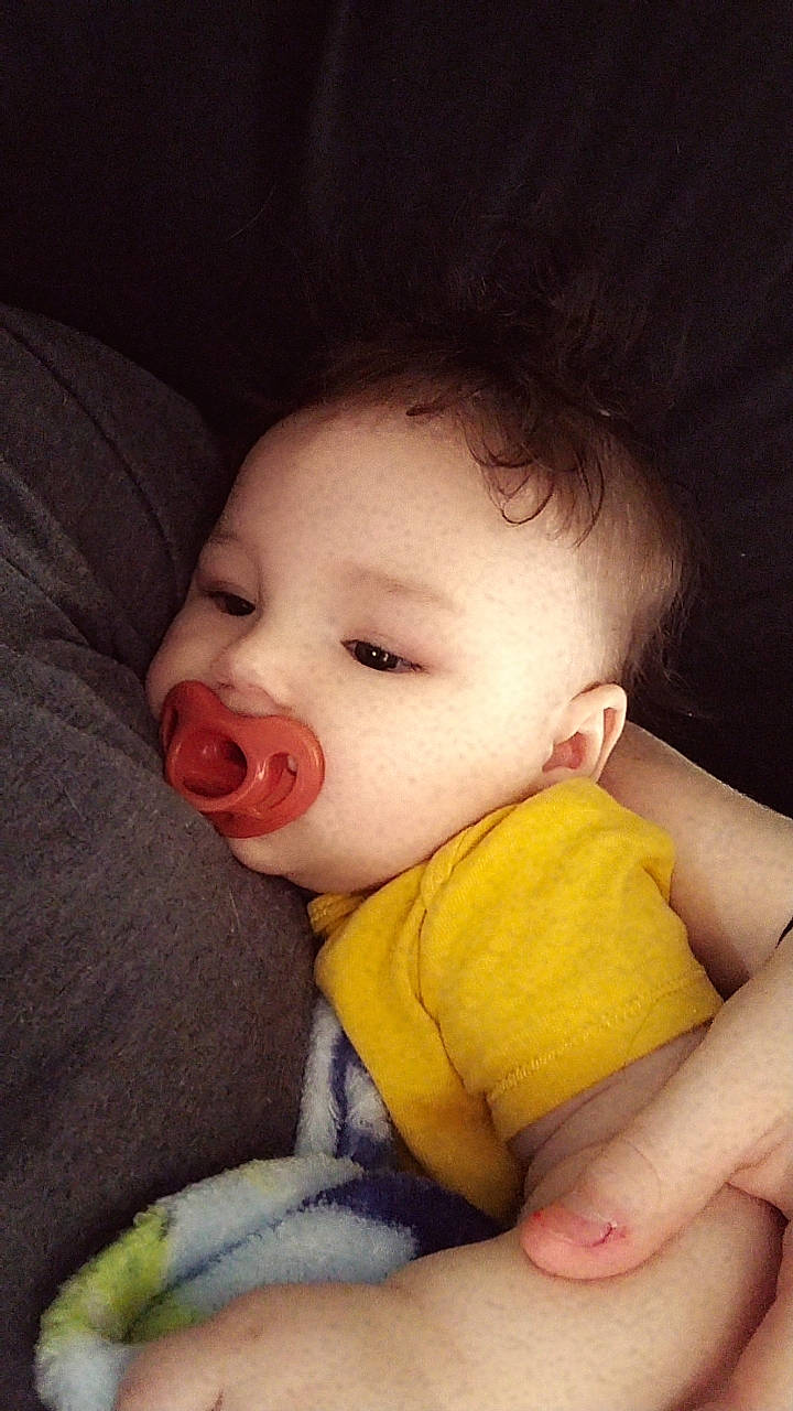 Legend is registered to the contest to win money with this photo: baby_toddler_clothing, cheek, chin, comfort, ear, eye, eyebrow, facial_expression, forehead, hair, hand, head, human_body, iris, leg, lip, mouth, neck, nose, person