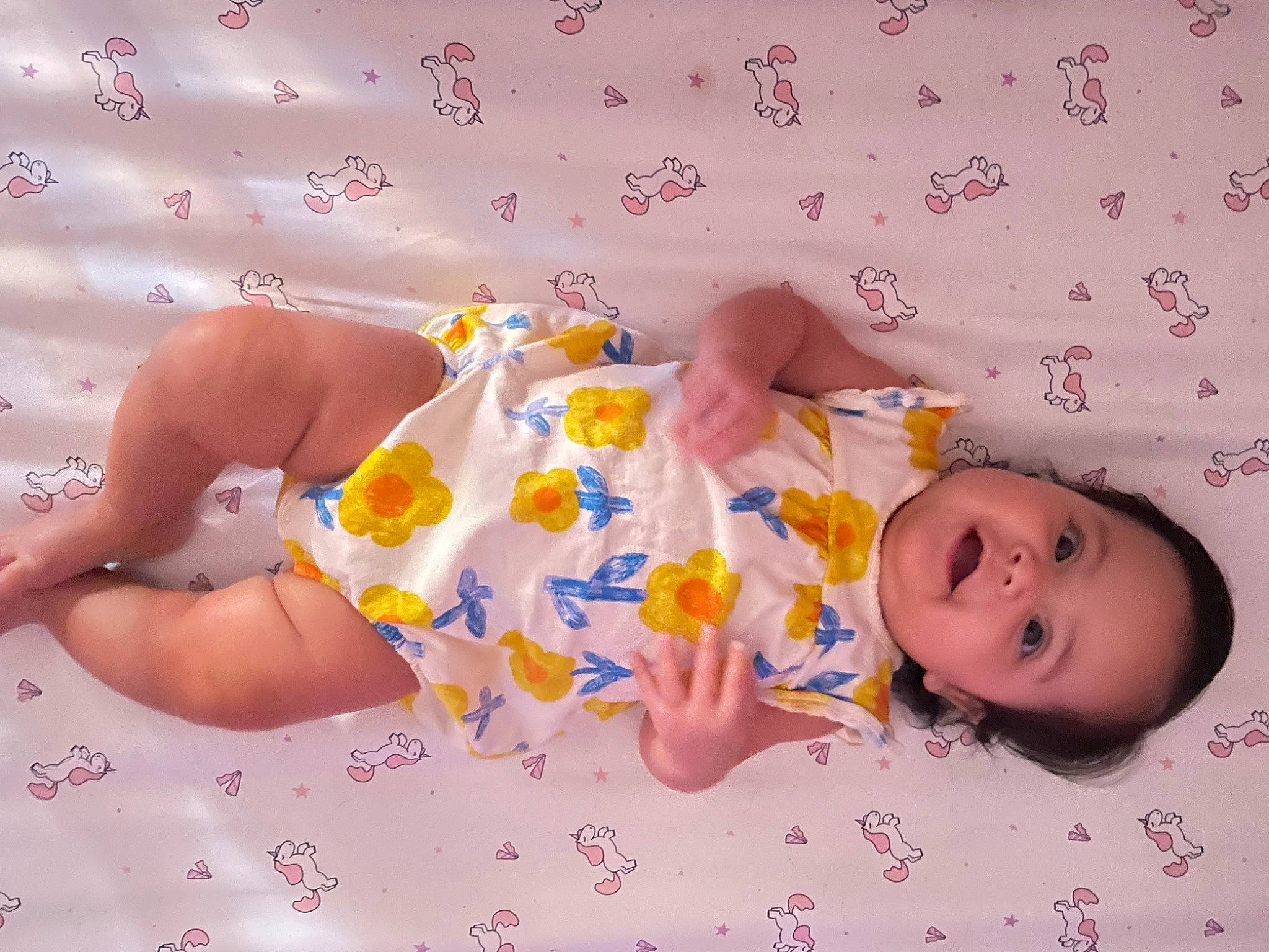 Alexis is registered to the contest to win money with this photo: baby, baby_products, baby_toddler_clothing, cheek, child, comfort, finger, fun, hand, happy, linens, pattern, person, pink, product, room, skin, sleeve, smile, textile