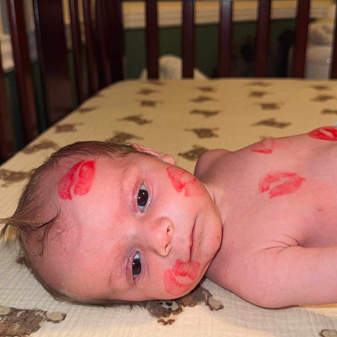 Karter is registered to the contest to win money with this photo: baby, bedroom, blanket, child, closeup, crib, cute, expression, face, indoors, infant, kiss_marks, lying_down, portrait, skin, skin_markings, soft_lighting, teddy_bear_pattern, wooden_crib, young_child