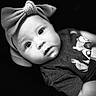 baby, child, headband, bow, black_and_white, portrait, face, eyes, clothing, shirt, cartoon, expression, infant, cute, closeup, soft_light, texture, young, human, indoor