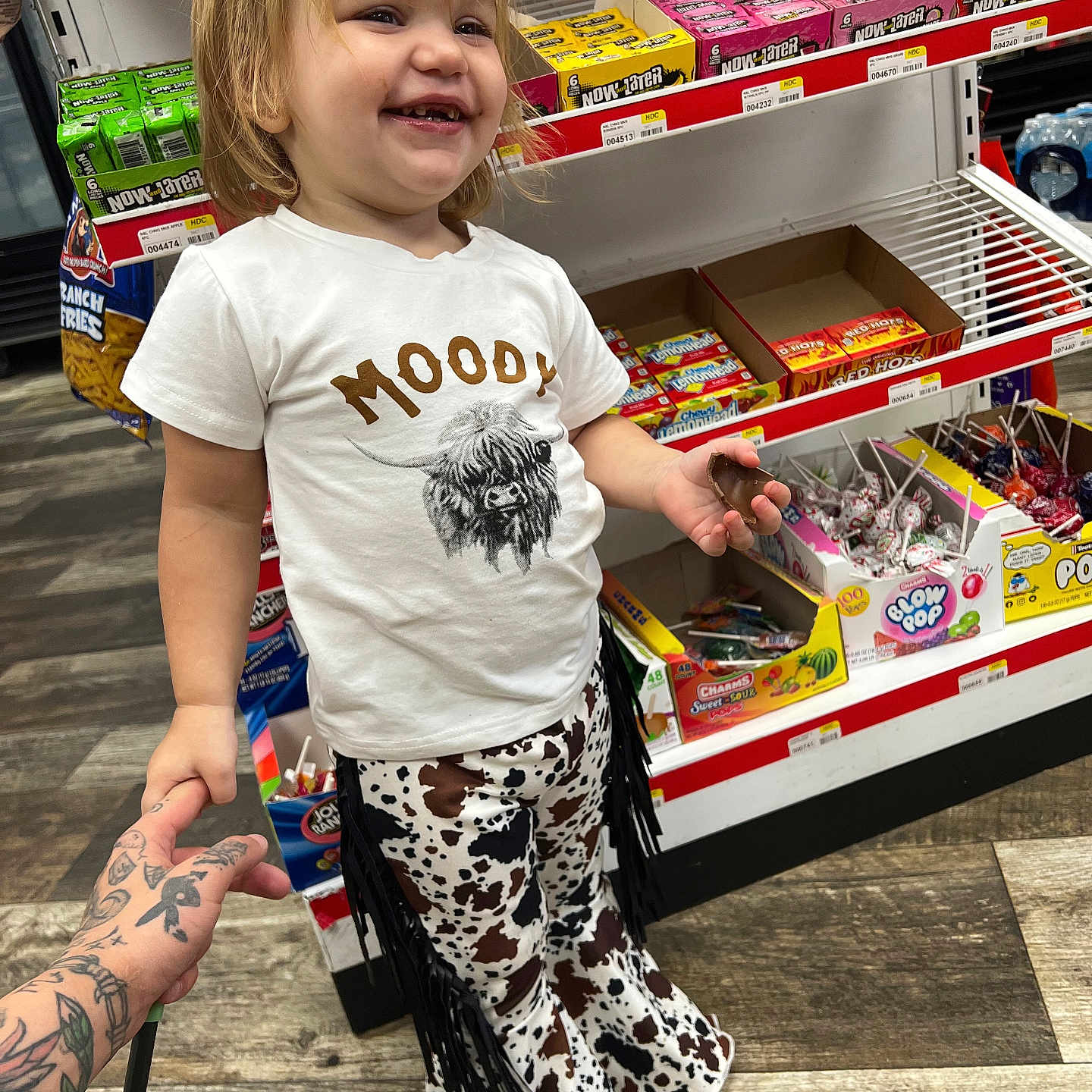 Piper joined the competition — help win amazing prizes! bodypart, candy, child, clothing, face, female, finger, food, girl, hand, head, person, photography, portrait, shelf, shorts, skin, sweets, t_shirt, tattoo