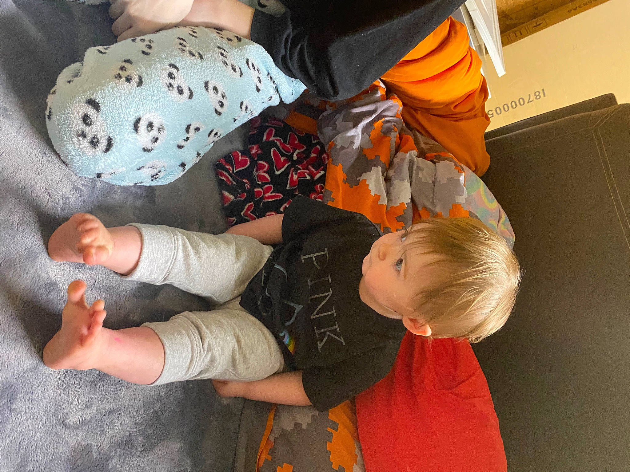 Avory joined the competition — help win amazing prizes! baby, baby_products, baby_toddler_clothing, child, comfort, elbow, flooring, foot, fun, human_leg, joint, knee, orange, pattern, person, room, sitting, sock, toddler, tree