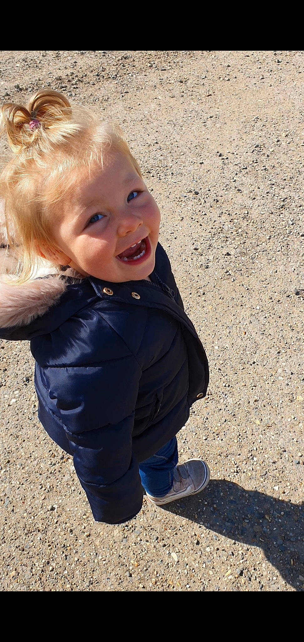 Elsie-rose joined the competition — help win amazing prizes! baby, blond, blue, cheek, child, eye, face, facial_expression, fun, head, jacket, nose, outerwear, people, person, play, sand, skin, smile, standing