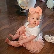 Addilynn joined the competition — help win amazing prizes! baby, child, tutu, bow, headband, balloon, floor, wooden_floor, shoe, pink, white_shirt, sitting, curious, indoor, cute, chubby_cheeks, person, infant, party, celebration