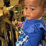Malya a rejoint le concours — aidez-le/la à gagner de superbes lots ! animal, barn, blue, child, curious, curly_hair, cute, dress, farm, fence, floral, goat, hay, indoor, interaction, person, petting_zoo, portrait, toddler, young_child