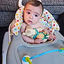 Cole joined the competition — help win amazing prizes! baby, high_chair, plush_toy, infant, indoor, colorful, curious, child, seat, furniture, soft_toy, expression, cute, hands, face, person, young, looking, playful, couch
