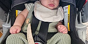 Cole joined the competition — help win amazing prizes! baby, car_seat, pacifier, knitwear, infant, child, seatbelt, straps, clothing, foot, hand, face, person, indoors, sitting, expression, cute, comfort, safety, bibs