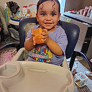 Jaeluv joined the competition — help win amazing prizes! toddler, child, smiling, high_chair, toy, indoor, curly_hair, baby, happy, person, furniture, play, room, clothing, seat, table, face, hand, expression, home