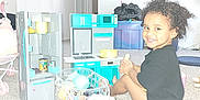 Jaeluv joined the competition — help win amazing prizes! child, toddler, smile, curly_hair, toy_kitchen, plastic_toys, basket, carpet, indoor, black_shirt, play, happy, young_child, home, room, plastic_container, floor, kitchen_toys, child_playing, toy_refrigerator