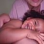 Jaeluv is registered to the contest to win money with this photo: toddler, child, smiling, curly_hair, happy, person, adult, hand, skin, face, indoor, casual_clothing, playful, affection, closeup, joy, family, care, human, portrait