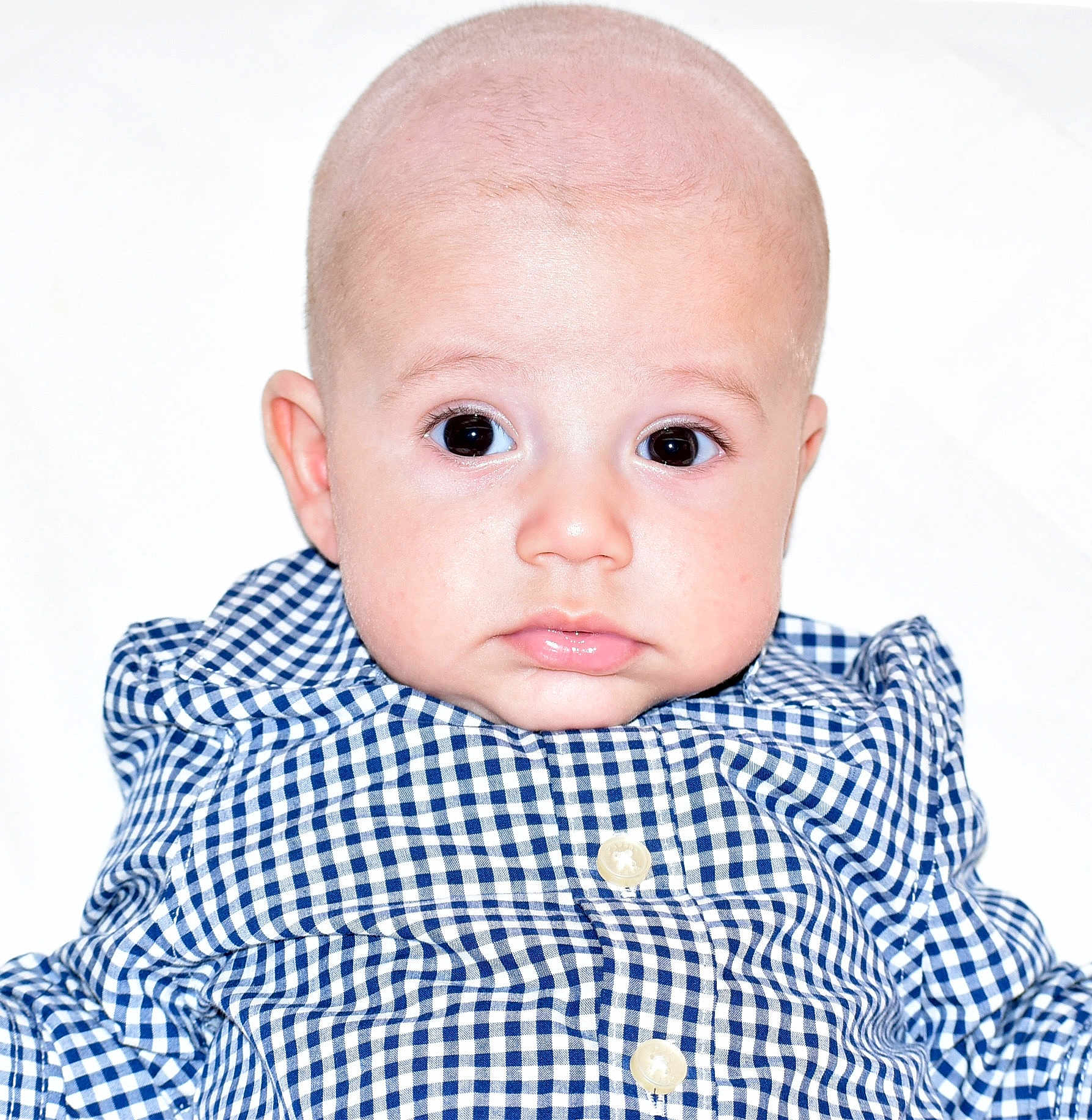 Yasin joined the competition — help win amazing prizes! baby, child, face, bald, blue_shirt, checkered, eyes, expression, portrait, infant, young, cute, looking, clothing, buttoned_shirt, skin, head, indoors, person, closeup