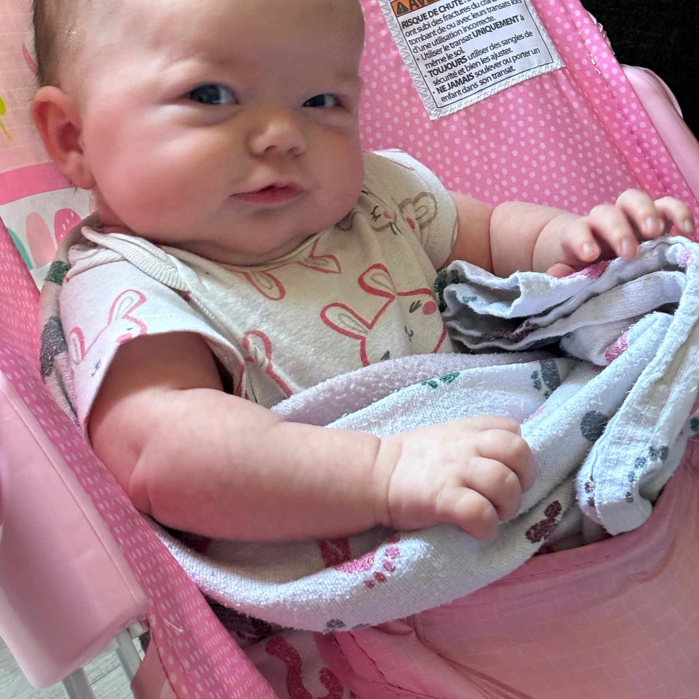 Sellia is registered to the contest to win money with this photo: baby, baby_chair, blanket, child, closeup, clothing, comfort, cute, expression, face, hand, indoor, infant, person, pink, polka_dot, relax, sitting, skin, soft_toy