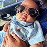 Grayson joined the competition — help win amazing prizes! baby, child, sunglasses, blue_shirt, car_interior, person, hand, reflection, cute, portrait, infant, clothing, seat, window, sunlight, holding, closeup, fashion, accessory, casual