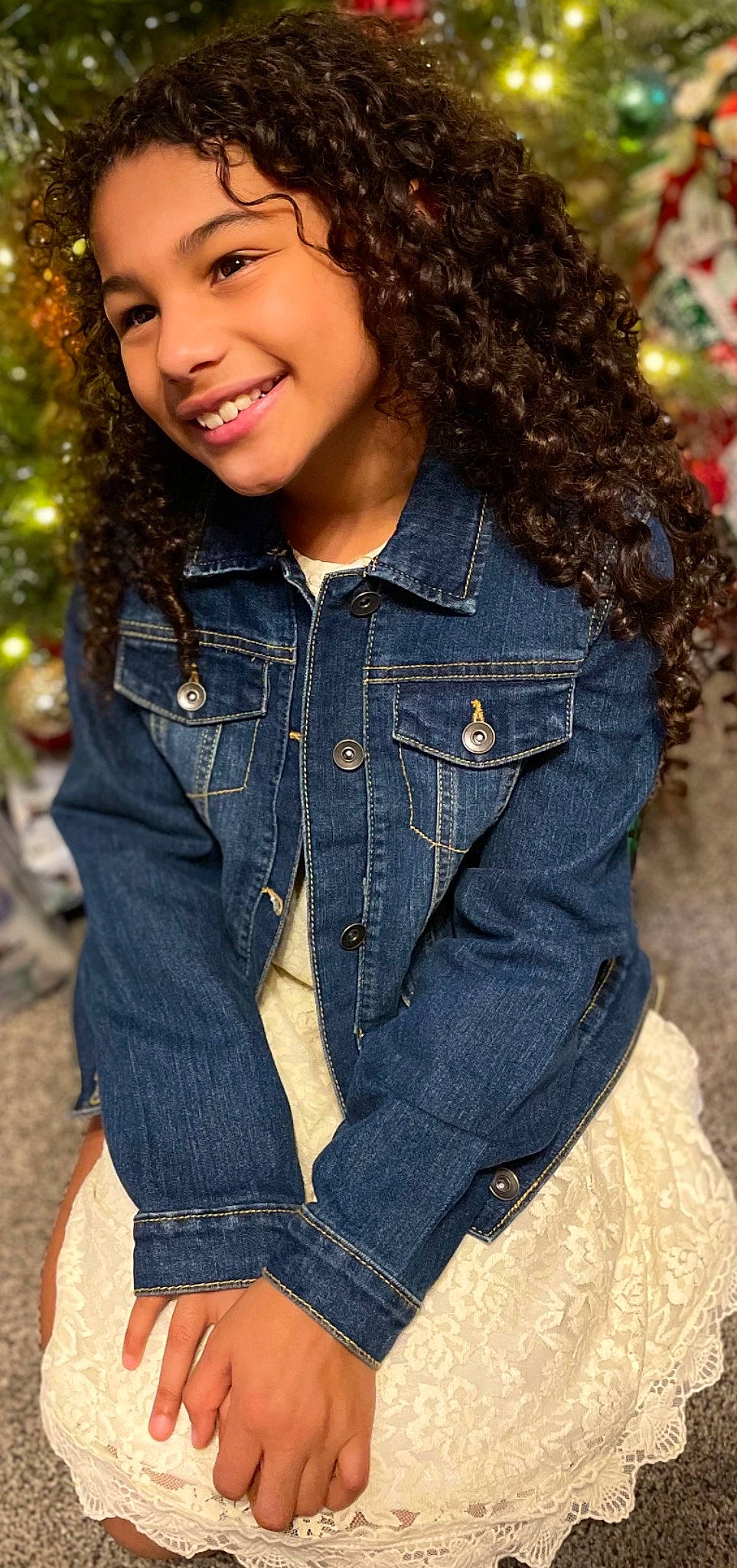 Adrionna is registered to the contest to win money with this photo: black_hair, brown_hair, clothing, denim, fashion, hair, hairstyle, jacket, jeans, joy, long_hair, outerwear, overall, person, pocket, smile, textile, thigh, waist