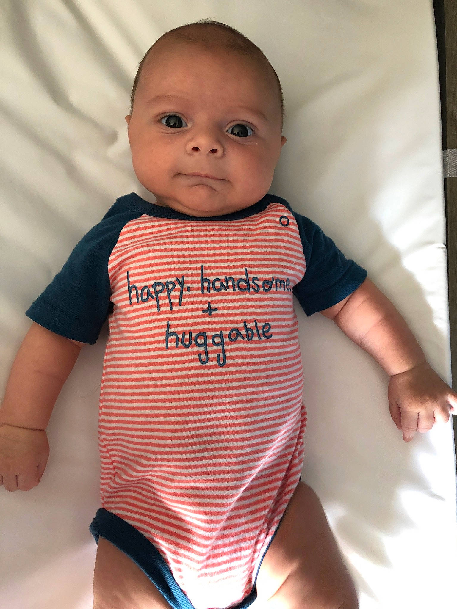 Peter John is registered to the contest to win money with this photo: baby, baby_products, baby_toddler_clothing, cheek, child, face, head, lip, person, pink, product, skin, sleeve, t_shirt, toddler