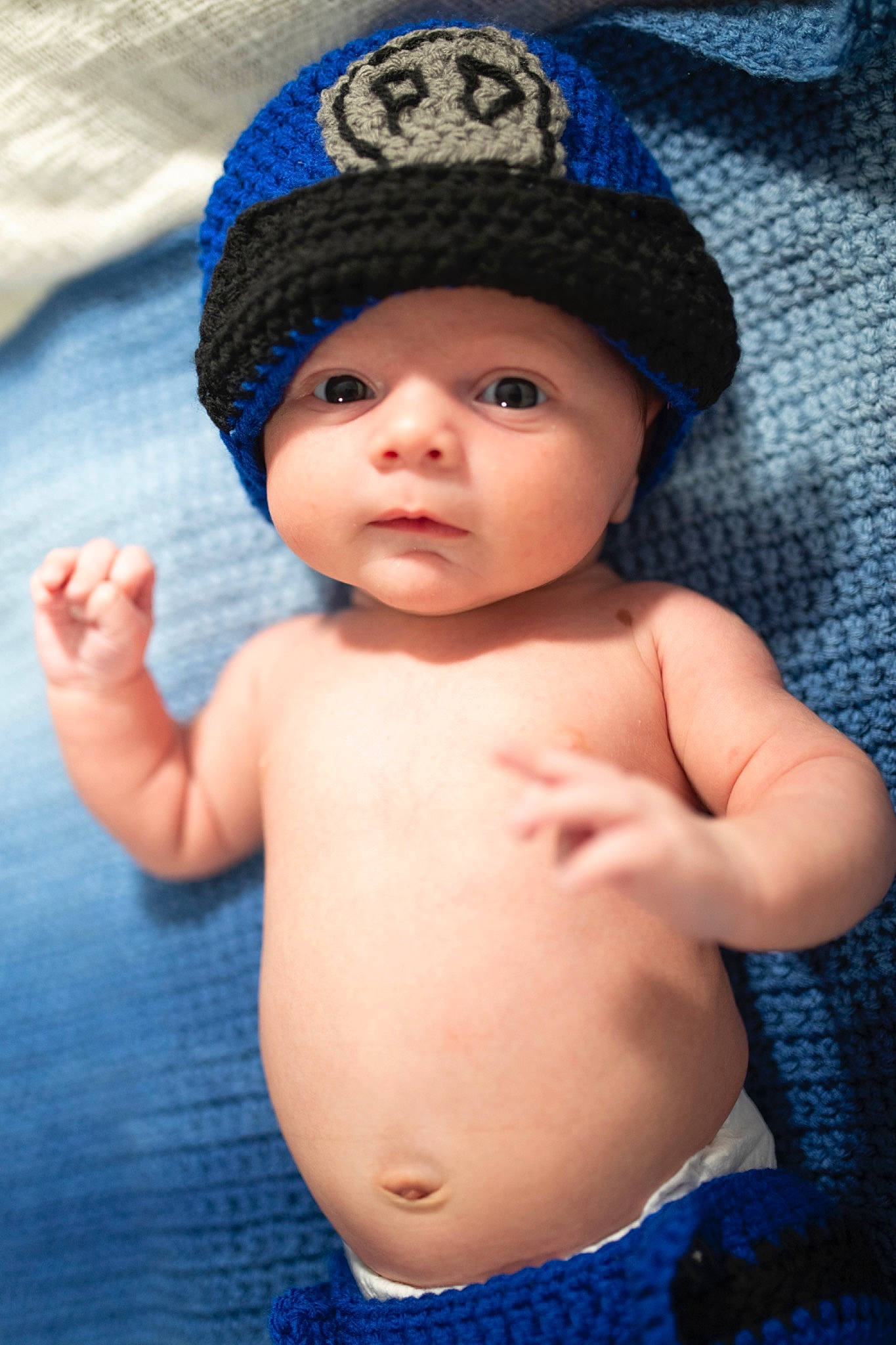 Peter John is registered to the contest to win money with this photo: baby, beanie, bonnet, cap, cheek, child, costume_accessory, fashion_accessory, hat, headgear, knit_cap, person, skin, toddler