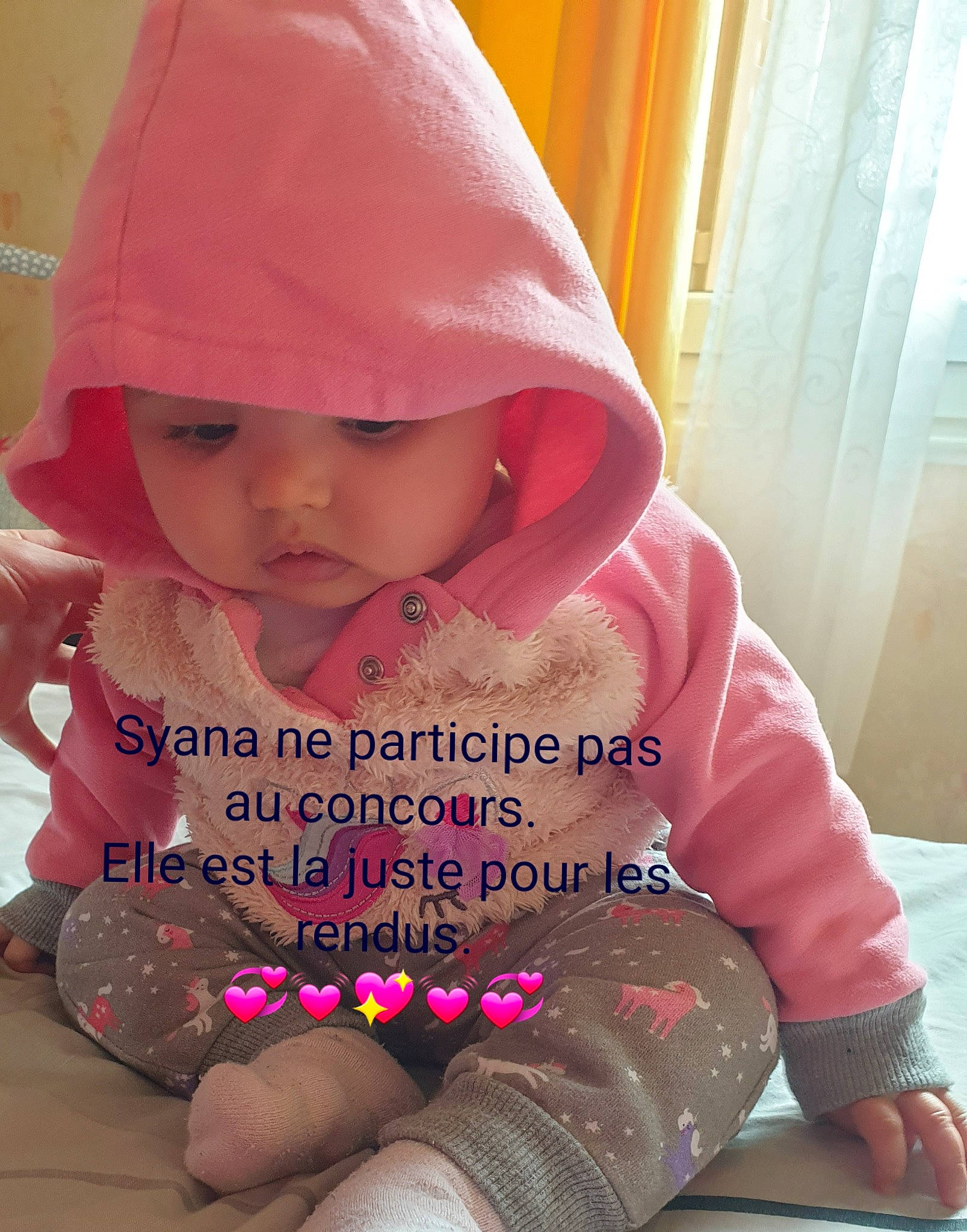 Syana participe au concours pour gagner de l'argent avec cette photo : baby, baby_products, baby_toddler_clothing, beauty, cap, cheek, child, face, fashion_accessory, happy, headgear, leisure, magenta, outerwear, person, pink, sitting, skin, sleeve, textile