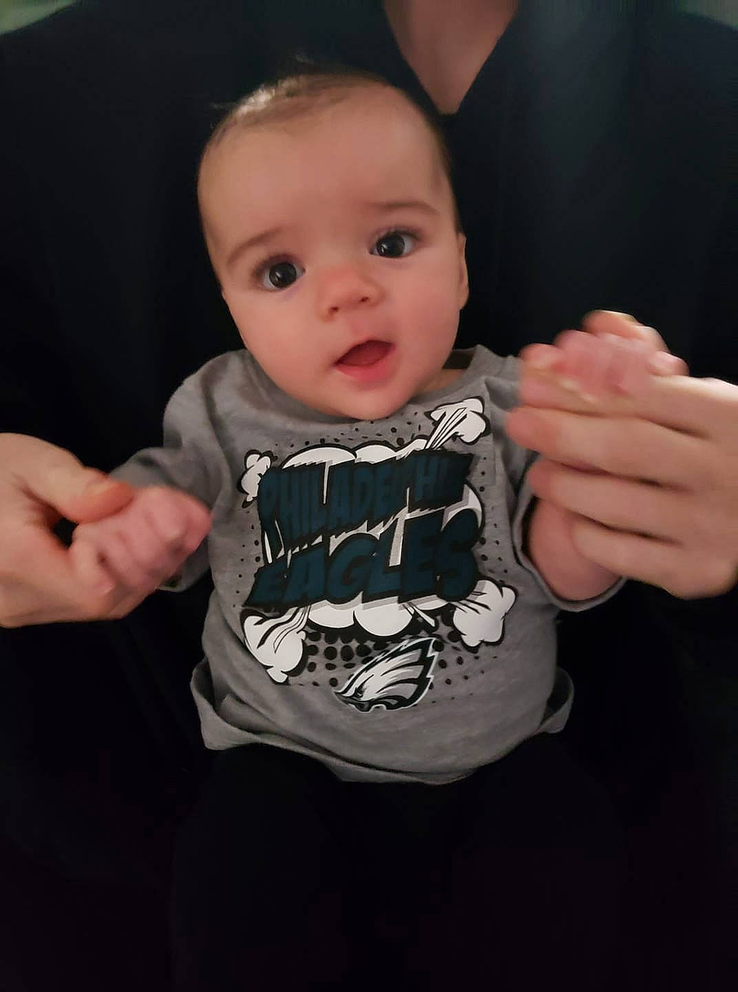 Shawn Jr is registered to the contest to win money with this photo: baby, baby_products, cheek, child, eye, face, finger, gesture, hand, head, person, product, skin, sleeve, t_shirt, thumb, toddler