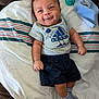 Sebastian joined the competition — help win amazing prizes! adidas, baby, blanket, child, clothing, couch, cute, face, happy, indoor, infant, lying_down, person, portrait, resting, shirt, shorts, smiling, socks, striped_socks
