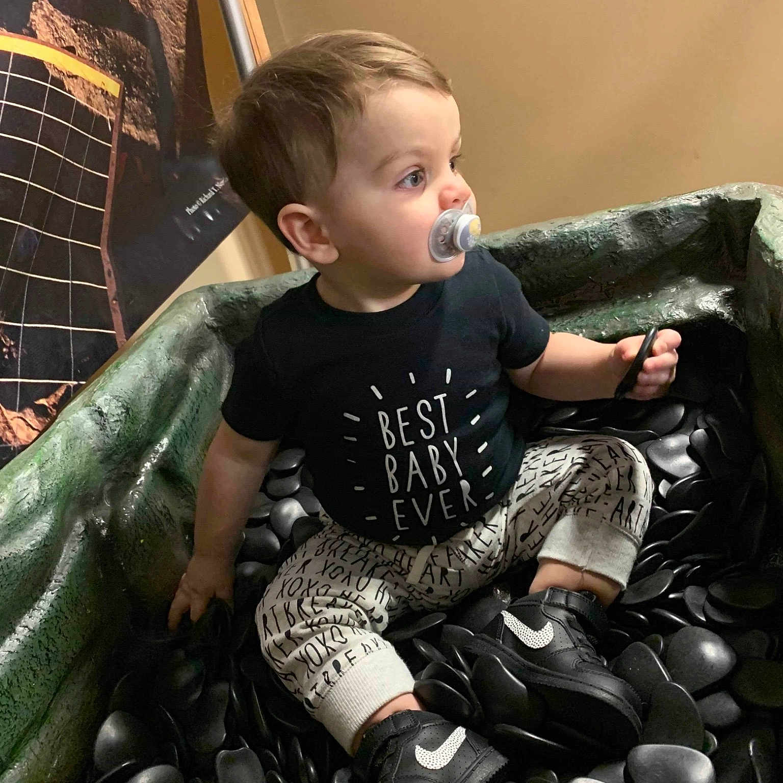 Khyrie is registered to the contest to win money with this photo: child, person, sitting