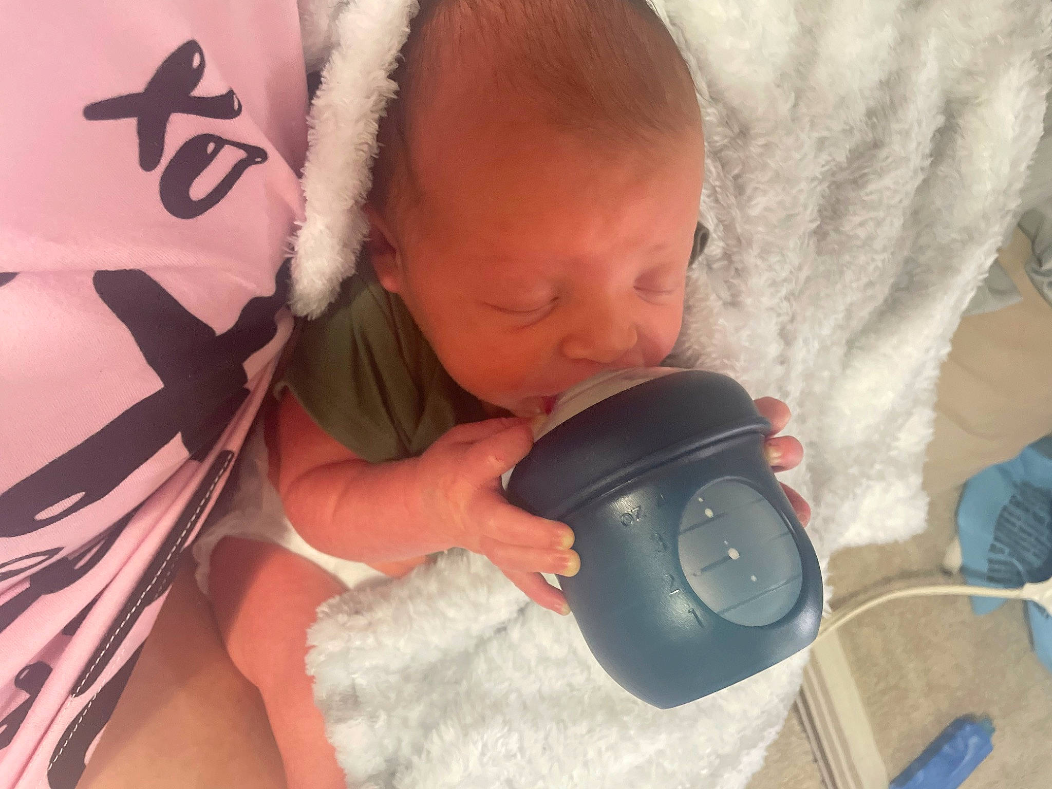 Kyzer is registered to the contest to win money with this photo: audio_equipment, baby, baby_sleeping, baby_toddler_clothing, cheek, comfort, drinkware, ear, eyelash, facial_expression, finger, happy, headgear, hearing, helmet, mouth, nose, person, personal_protective_equipment, skin