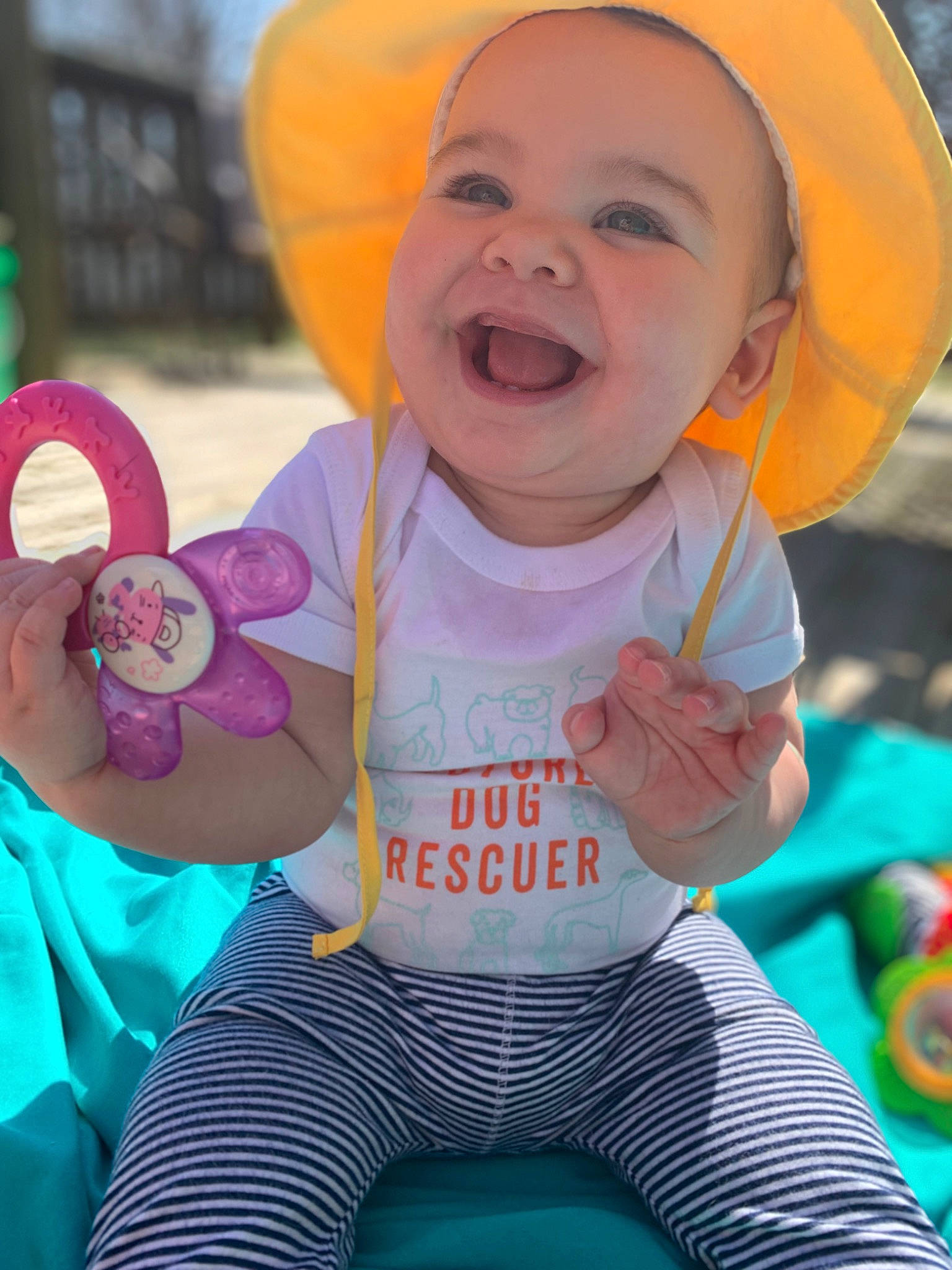 Georgia is registered to the contest to win money with this photo: baby_toddler_clothing, blue, face, facial_expression, fun, green, happy, head, human, joy, orange, organ, person, pink, product, purple, skin, sleeve, smile, textile