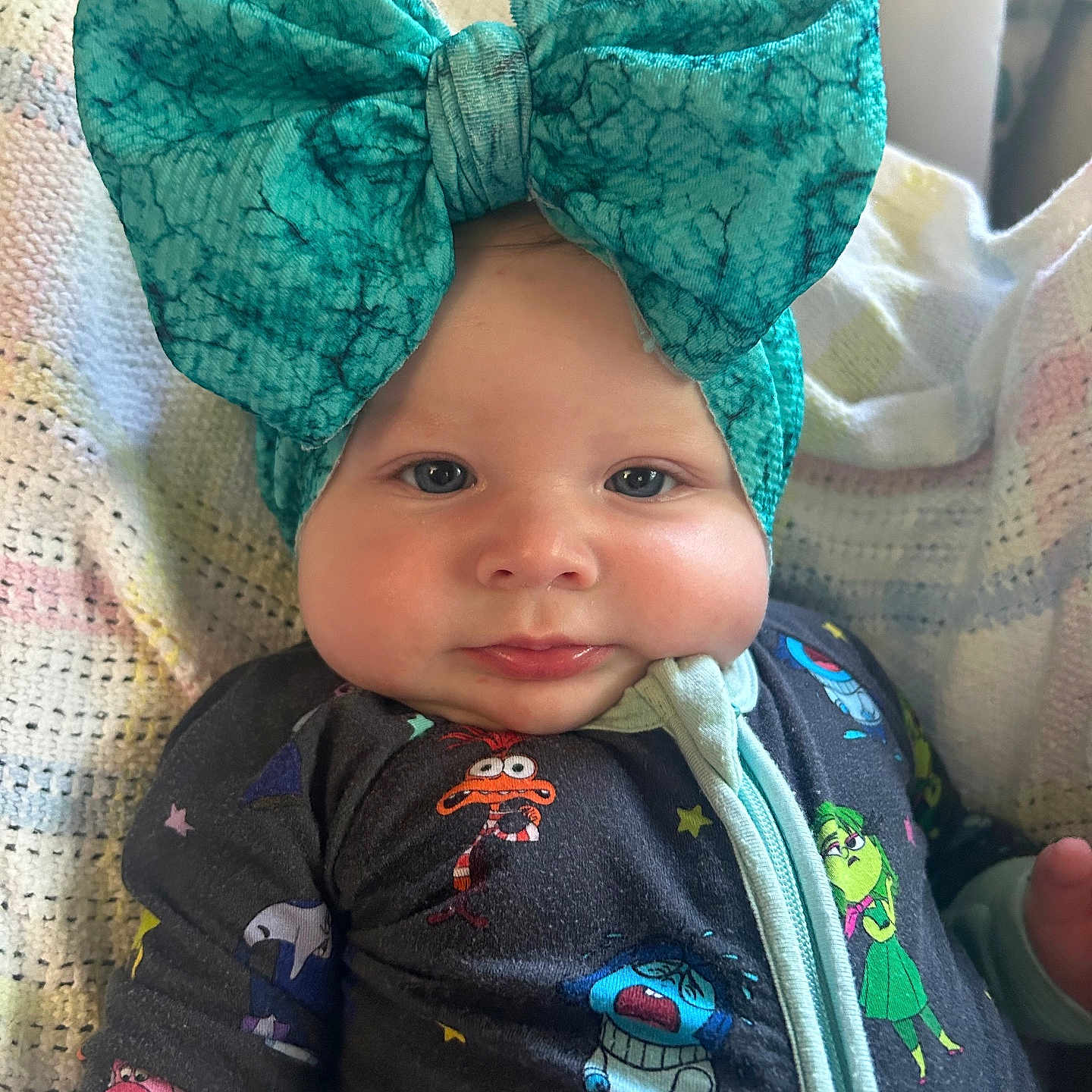 Azalea Charlotte joined the competition — help win amazing prizes! baby, blanket, blue, bow, cartoon, cheeks, child, closeup, clothing, cute, face, headband, indoors, infant, onesie, person, portrait, sleepwear, smile, soft