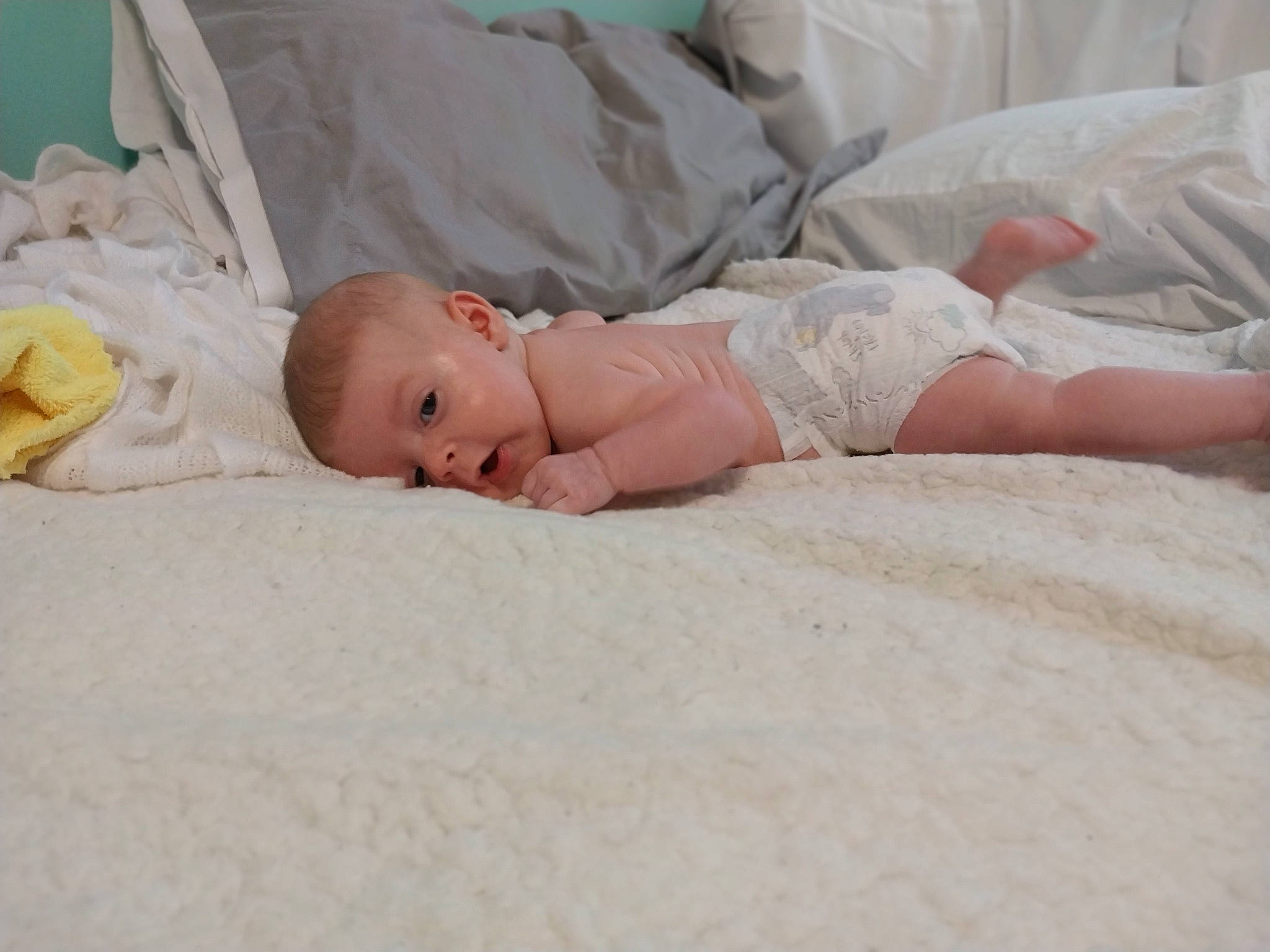 Brinleigh is registered to the contest to win money with this photo: art, baby, baby_products, baby_safety, baby_sleeping, baby_toddler_clothing, bedding, bedtime, child, comfort, event, flooring, grass, hat, linens, nap, person, room, skin, toddler