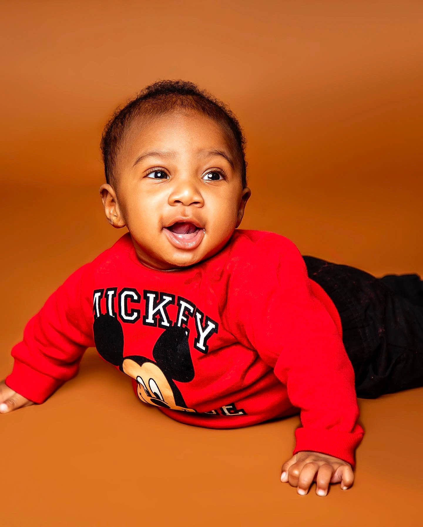 Tony is registered to the contest to win money with this photo: baby, baby_toddler_clothing, cheek, eye, eyebrow, finger, flash_photography, flooring, fun, hair, happy, human_body, mammal, nose, outerwear, person, skin, sleeve, smile, standing