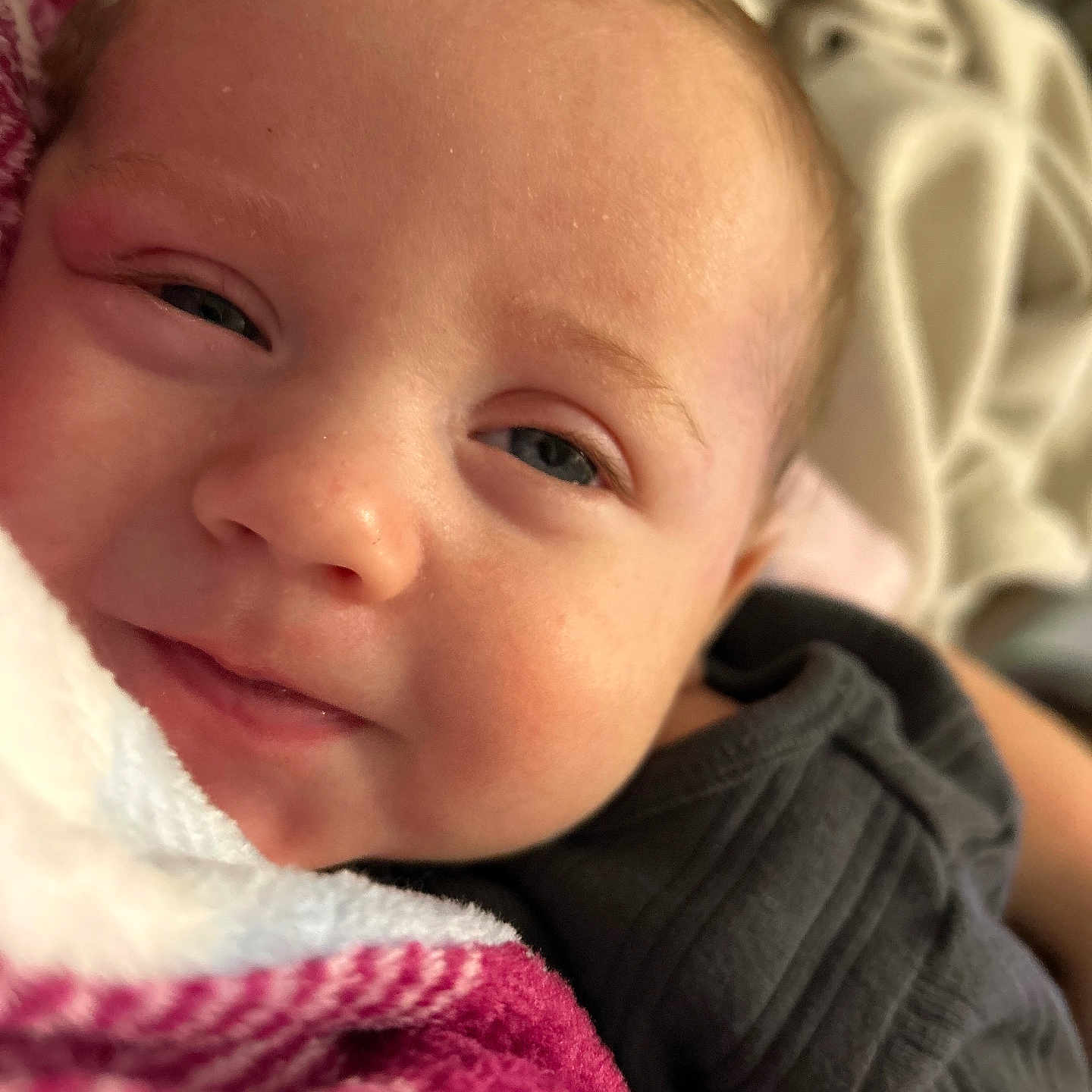 Jasper is registered to the contest to win money with this photo: baby, blanket, bodypart, clothing, coat, face, finger, hand, happy, head, jacket, laughing, newborn, person, photography, portrait, quilt, selfie, smile, towel