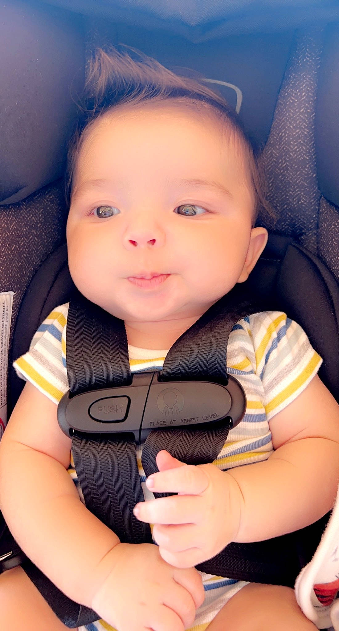 Aziel is registered to the contest to win money with this photo: arm, baby, baby_carriage, baby_in_car_seat, baby_safety, baby_toddler_clothing, cheek, cloud, comfort, cool, finger, flash_photography, gesture, hand, happy, person, seat_belt, skin, smile, thumb