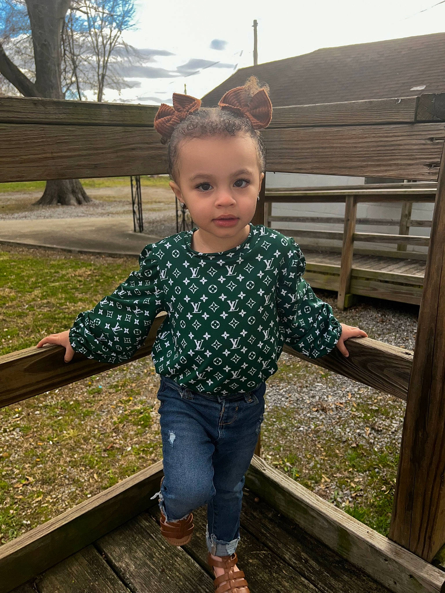 Riverlyn is registered to the contest to win money with this photo: child, denim, face, fun, grass, happy, jeans, leisure, pattern, people_in_nature, person, plant, recreation, sitting, sky, sleeve, standing, toddler, tree, waist