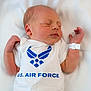 Christopher is registered to the contest to win money with this photo: newborn, baby, sleeping, onesie, clothing, white, infant, peaceful, soft, blanket, portrait, child, cute, human, person, resting, small, wearing, logo, indoors