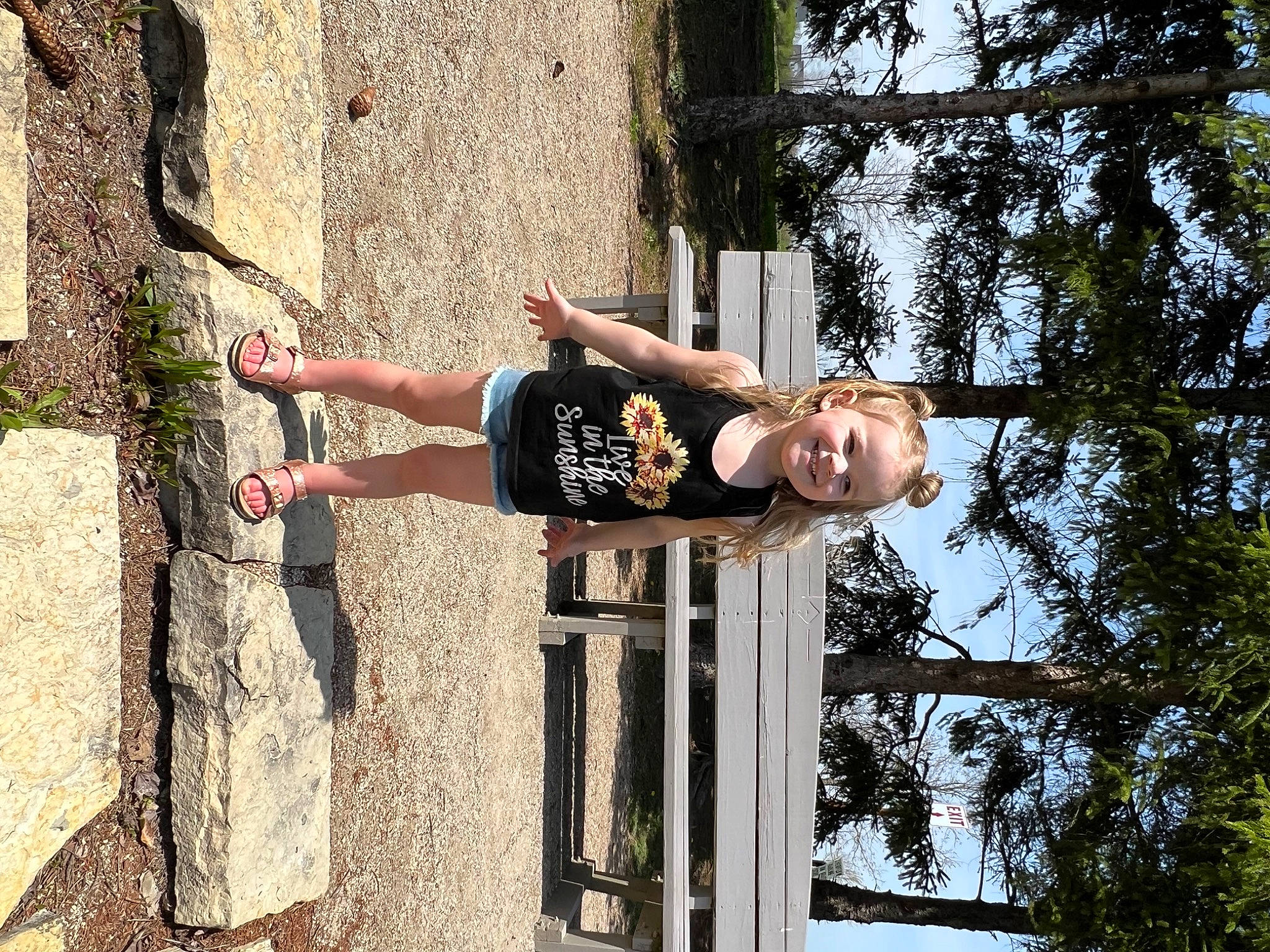 Isabella is registered to the contest to win money with this photo: adventure, elbow, facade, fun, human_leg, joy, leisure, people_in_nature, person, plant, recreation, shorts, smile, street_fashion, t_shirt, thigh, tree, waist, wood, woody_plant