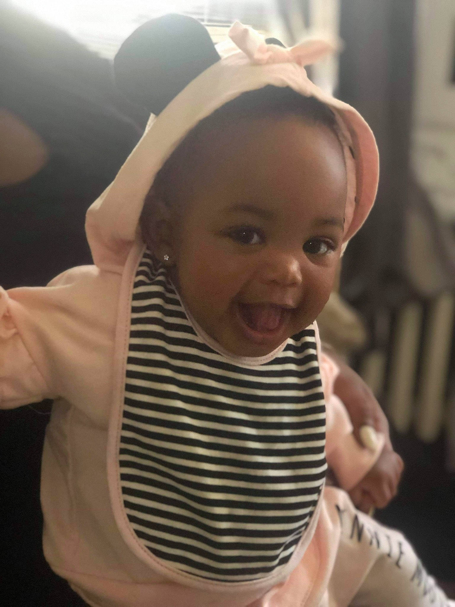 Aaniyah is registered to the contest to win money with this photo: arm, baby, cheek, child, cool, daughter, ear, face, facial_expression, finger, forehead, gesture, hand, head, headgear, neck, person, skin, smile, thumb
