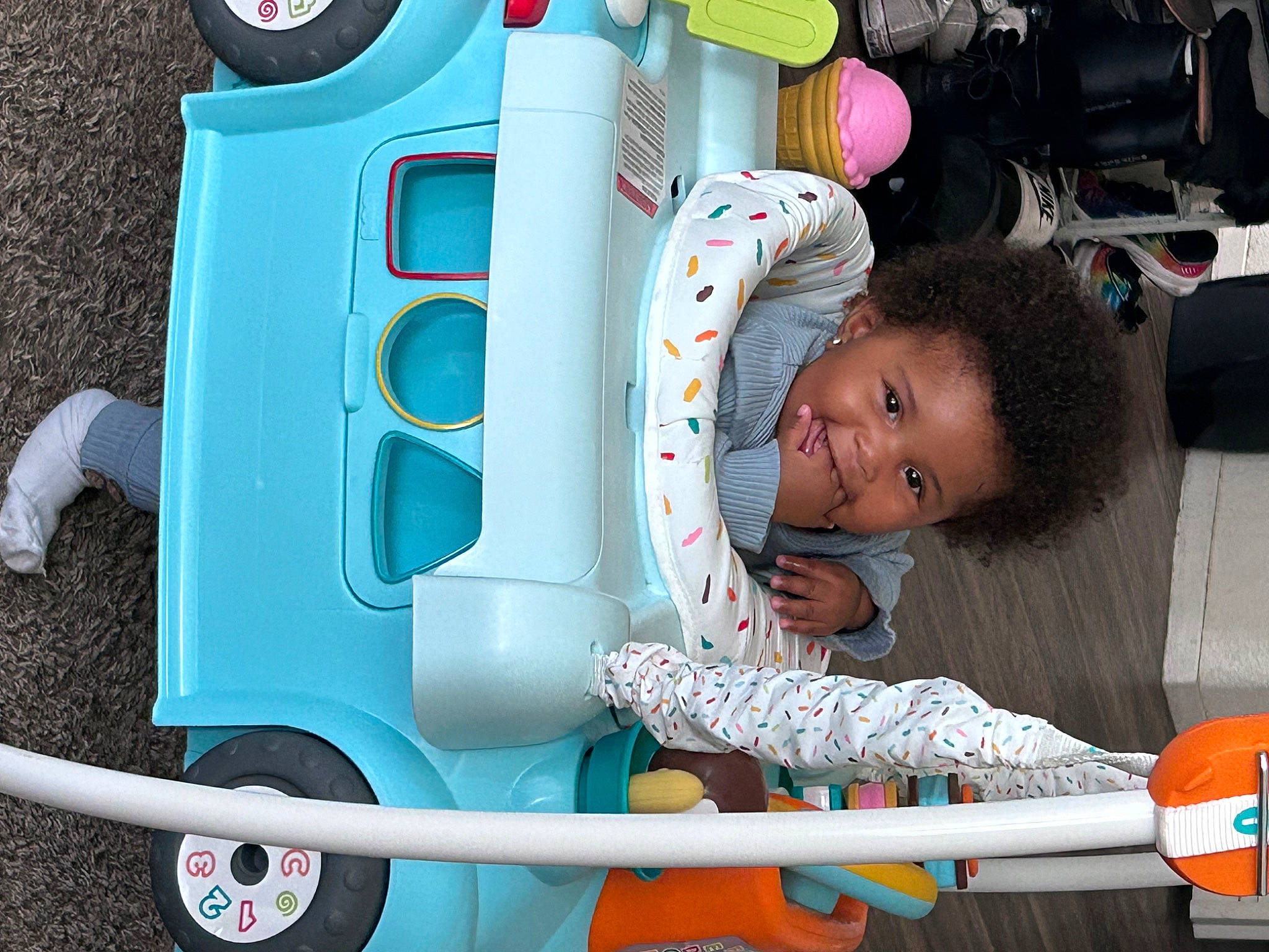 Journi joined the competition — help win amazing prizes! baby, baby_products, baby_toddler_clothing, child, facial_expression, fun, green, joy, leisure, motor_vehicle, person, photograph, pink, public_space, red, riding_toy, tire, toddler, toy, vehicle