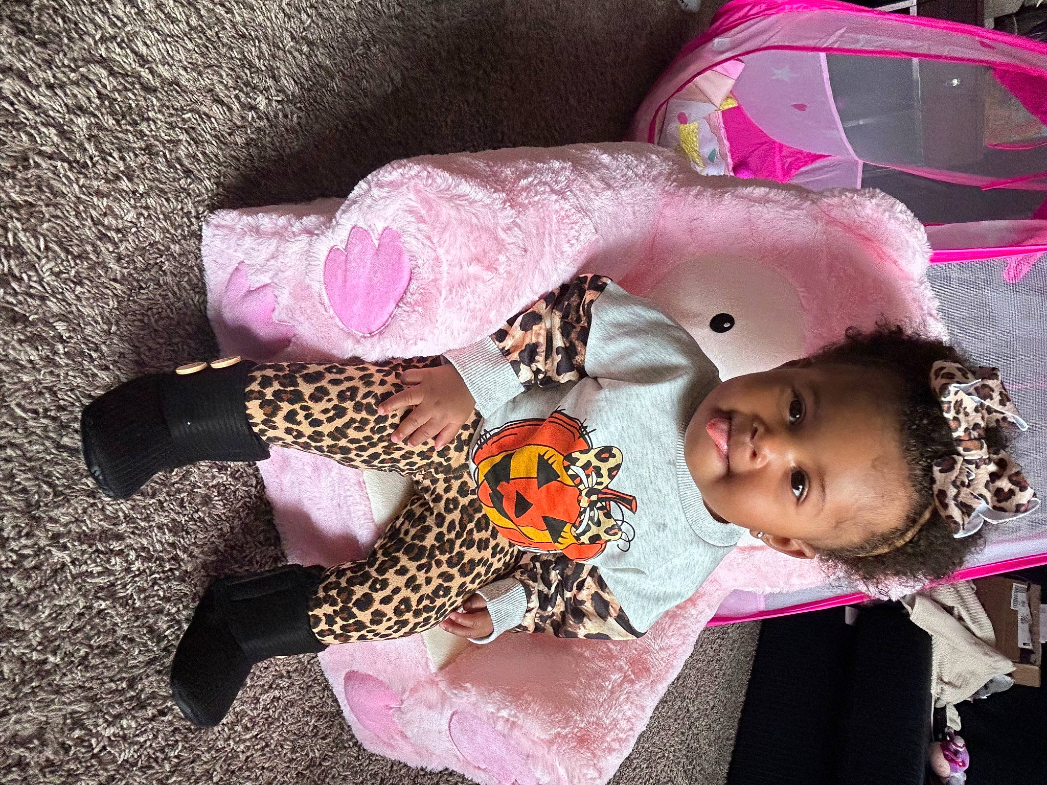 Journi is registered to the contest to win money with this photo: baby, baby_products, baby_toddler_clothing, cheek, child, dress, fashion_accessory, foot, fun, human_leg, magenta, pattern, person, pink, play, sleeve, thigh, toddler