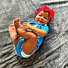 baby, child, smiling, blue_onesie, red_bow, headband, feet, hands, blanket, soft_texture, happy, cute, infant, playful, lying_down, indoors, portrait, one_person, toddler, skin