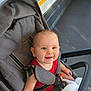 Nina participe au concours pour gagner de l'argent avec cette photo : baby, stroller, smiling, child, plush_toy, red_clothing, seat, bus_interior, handrail, happy, infant, straps, floor, window, casual, cute, transportation, indoor, person, bright