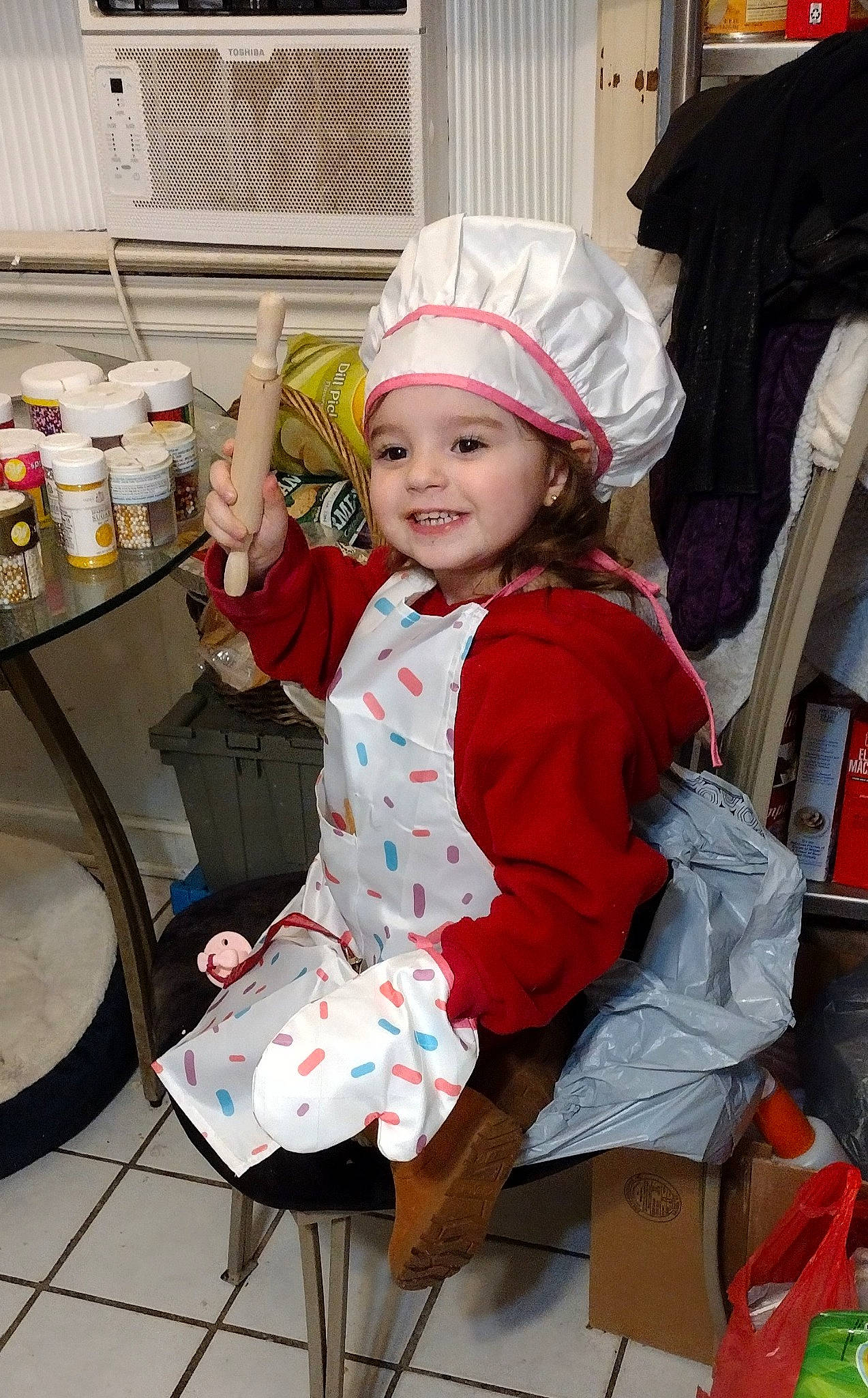 Aspyn joined the competition — help win amazing prizes! baby, baby_toddler_clothing, cap, chair, child, cooking, costume, costume_hat, event, fun, happy, headwear, holiday, joy, lap, person, personal_protective_equipment, sitting, smile, sock