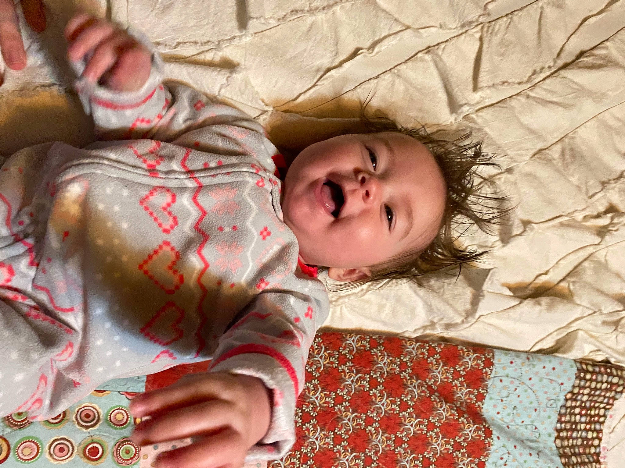 Adalynn is registered to the contest to win money with this photo: baby, bedding, bedtime, child, comfort, flesh, fur, grass, happy, head, linens, nap, pattern, person, plaid, portrait_photography, sleeve, textile, toddler, tree